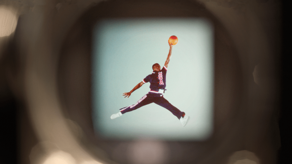 Michael Jordan jumping through the air