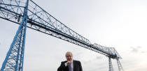 Britain's Prime Minister Boris Johnson poses for a picture during a visit to Wilton Engineering Services, part of a General Election campaign trail stop in Middlesbrough, England, Wednesday, Nov. 20, 2019. Britain goes to the polls on Dec. 12. (AP Photo/Frank Augstein, Pool)