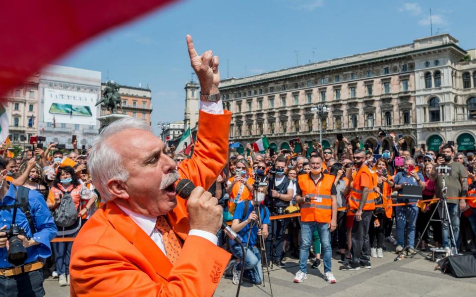 Former police general Antonio Pappalardo, founder of the Orange Jackets protest movement, addresses supporters in Milan - Shutterstock