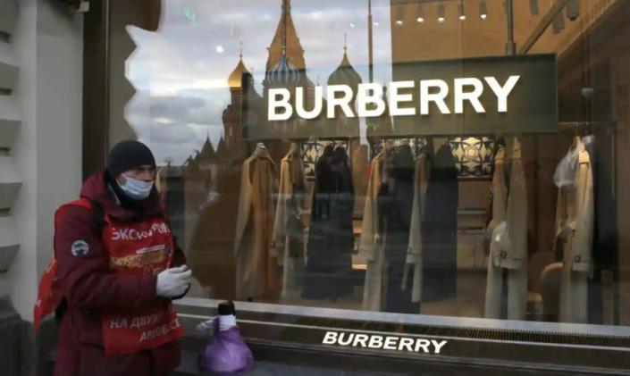 Russian worker stands outside of luxury fashion house Burberry.
