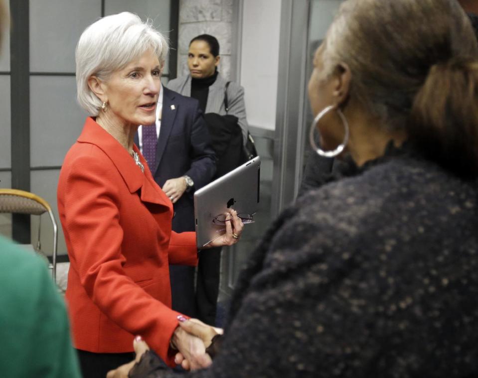 FILE - In this Feb. 3, 2014 file photo, Health and Human Services Secretary Kathleen Sebelius greets visitors after a news conference on enrollment in affordable health coverage in Cleveland. The Obama administration says about 1 million Americans signed up for private insurance under the president’s health care law in January, extending a turnaround from early days when a dysfunctional website frustrated consumers. New numbers released Tuesday show nearly 3.3 million people signed up through Feb. 1. Although enrollment is gaining ground, the government’s initial target of 7 million by the end of March still seems like a stretch. (AP Photo/Mark Duncan, File)