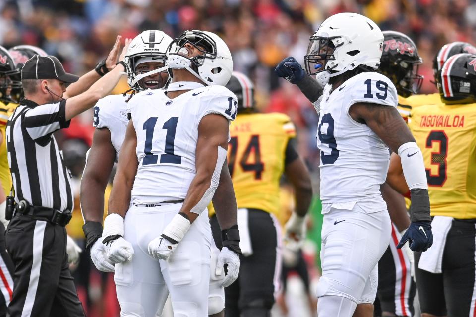 Linebacker Abdul Carter (11) and up-and-coming defensive end Jameial Lyons (19) will lead Penn State's top-ranked defense in the Peach Bowl against Ole Miss.