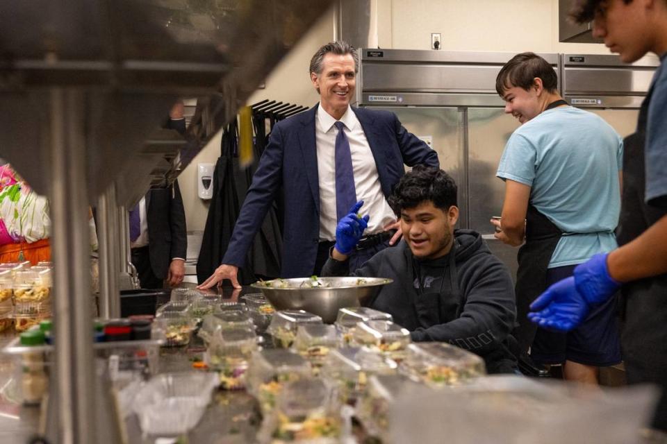 Gov. Gavin Newsom smiles with students in the Career Technical Education Pathways program at River City High School in West Sacramento on Thursday. Paul Kitagaki Jr./pkitagaki@sacbee.com