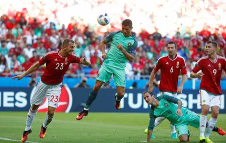 Football Soccer - Hungary v Portugal - EURO 2016 - Group F - Stade de Lyon, Lyon, France - 22/6/16 Portugal's Cristiano Ronaldo scores their third goal REUTERS/Kai Pfaffenbach