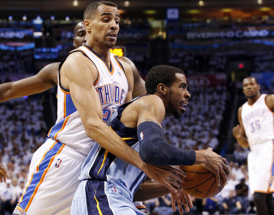 Memphis Grizzlies guard Mike Conley, right, drives around Oklahoma City Thunder guard Thabo Sefolosha in the first quarter of Game 5 of an opening-round NBA basketball playoff series in Oklahoma City, Tuesday, April 29, 2014. (AP Photo)