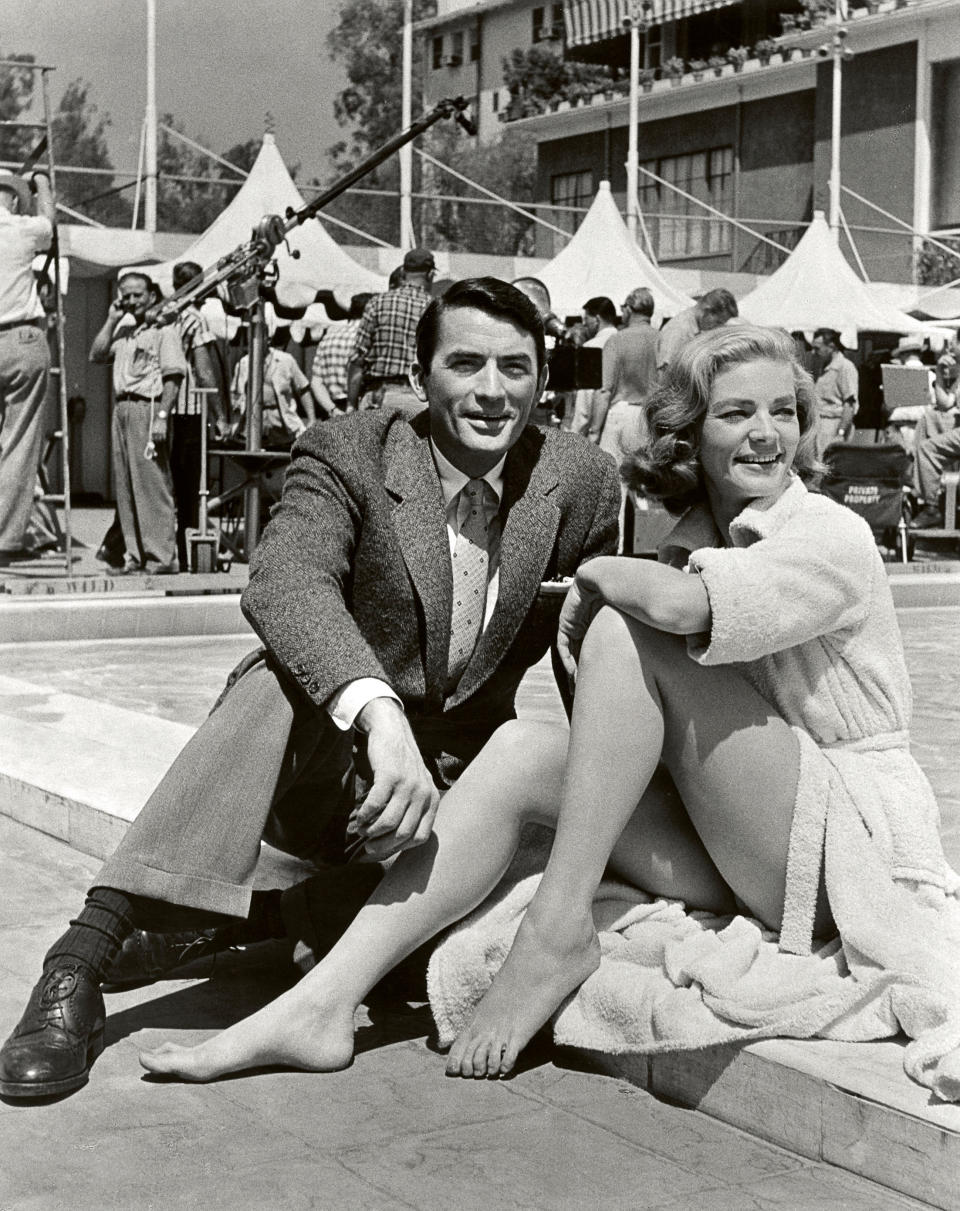 In this image released by Beverly Hills Collection, actors Gregory Peck, left, and Lauren Bacall are seen while shooting the film "Designing Woman" at The Beverly Hills Hotel. The Beverly Hills Hotel is celebrating its 100th Anniversary in May. (AP Photo/Beverly Hills Collection)