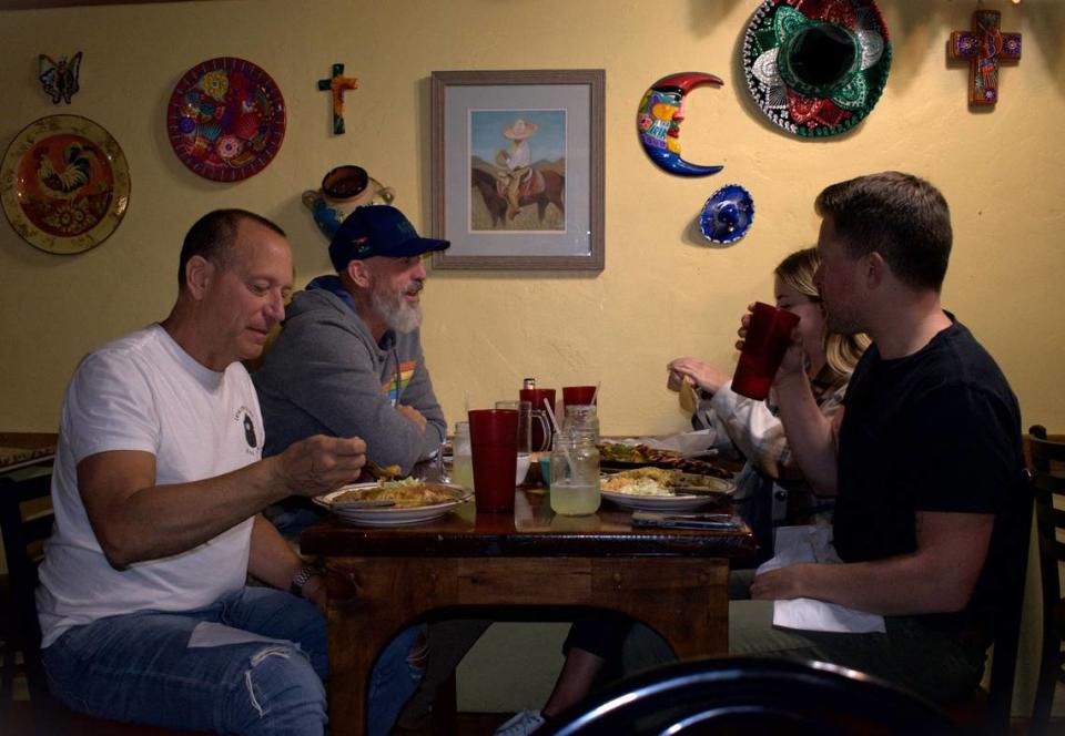 Jonathan Bailey, front left, Greg Carson, back left, Erik Dargitz, front right, and Rachel Haik, back right, have dinner at Castillo’s Mexican Restaurant on Monday night in Mariposa. Bailey, Carson and Haik are from San Diego and Dargitz is from Seattle, but the four were in town to visit Yosemite National Park.