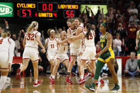 Iowa State players celebrate as Baylor guard Te'a Cooper (4) walks off the court at the end of an NCAA college basketball game, Sunday, March 8, 2020, in Ames, Iowa. (AP Photo/Charlie Neibergall)