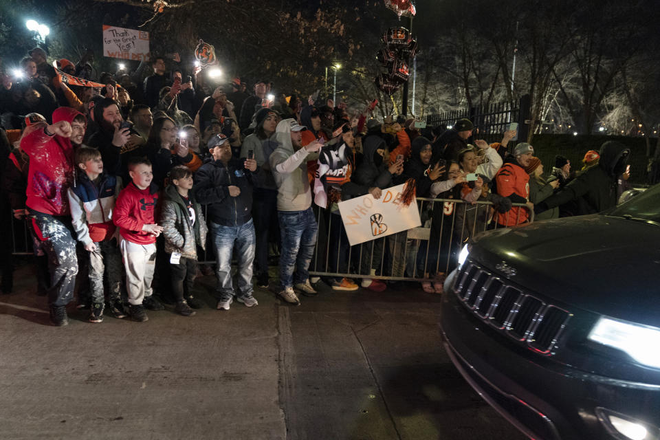 Fans cheer as Cincinnati Bengals players and staff leave Paul Brown Stadium on Monday, Feb. 14, 2022, in Cincinnati after returning from their NFL football Super Bowl 56 loss to the Los Angeles Rams.