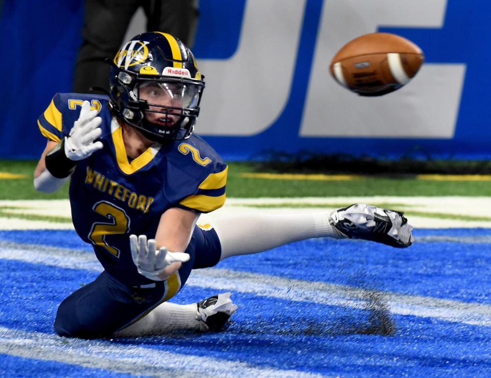 Whiteford's Ryin Ruddy dives to try and catch a pass from his brother Shea Ruddy in last year's Division 8 state finals. Shea Ruddy has graduated and Ryin will move to quarterback as the Bobcats try to defend their state title.