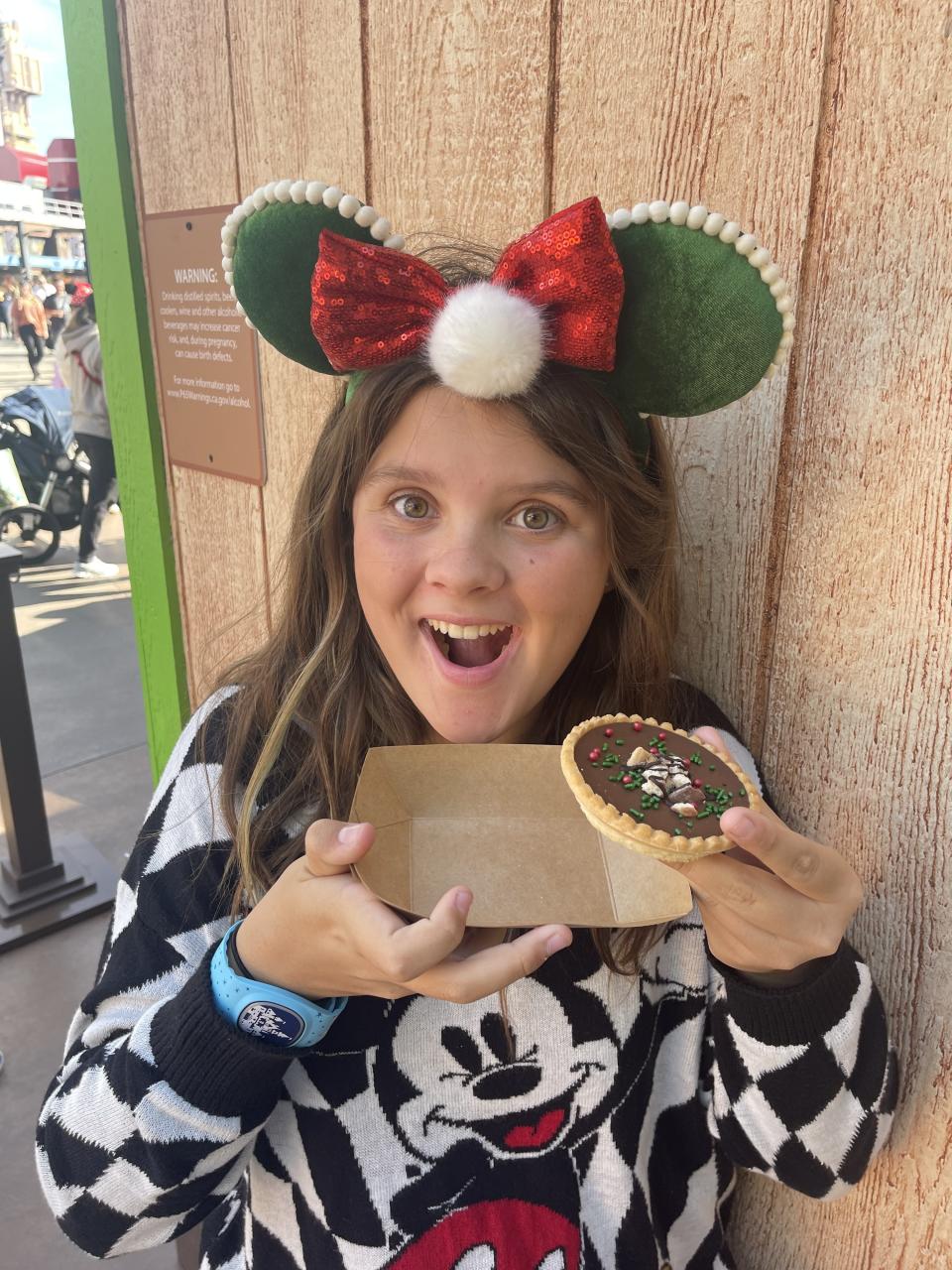 the author's daughter looking excited about her dessert