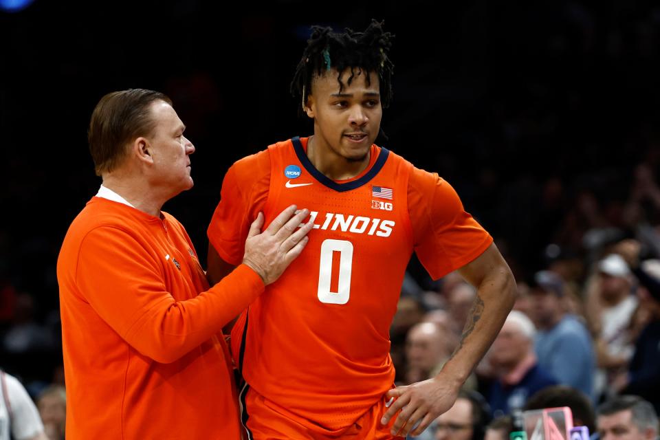 Illinois head coach Brad Underwood talks with guard Terrence Shannon Jr. during the Elite Eight game against Connecticut on March 30, 2024.