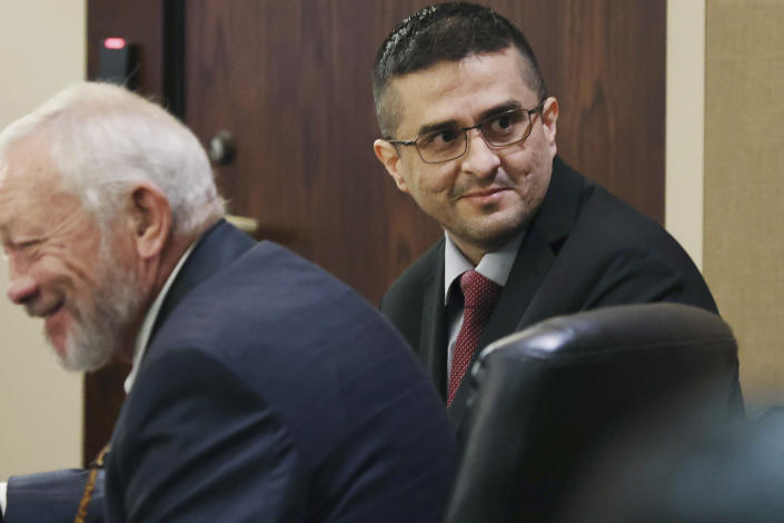 Capital murder defendant and former U.S. Border Patrol Juan David Ortiz looks around the courtroom before the start of the first day of the trial before Webb County State District Court Judge Oscar J. Hale, Monday, Nov. 28, 2022. Ortiz is charged in the 2018 deaths of four women near Laredo. The trial was moved to San Antonio because of pretrial media coverage in Laredo. (Jerry Lara/The San Antonio Express-News via AP)