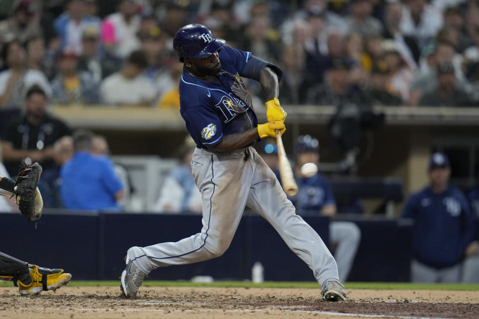 Tampa Bay Rays' Randy Arozarena hits a three-run home run during the fifth inning of a baseball game against the San Diego Padres, Friday, June 16, 2023, in San Diego. (AP Photo/Gregory Bull)