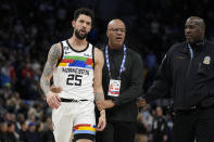 Minnesota Timberwolves guard Austin Rivers (25) exits the game after being ejected for participating in a scrum against the Orlando Magic during the second half of an NBA basketball game, Friday, Feb. 3, 2023, in Minneapolis. (AP Photo/Abbie Parr)