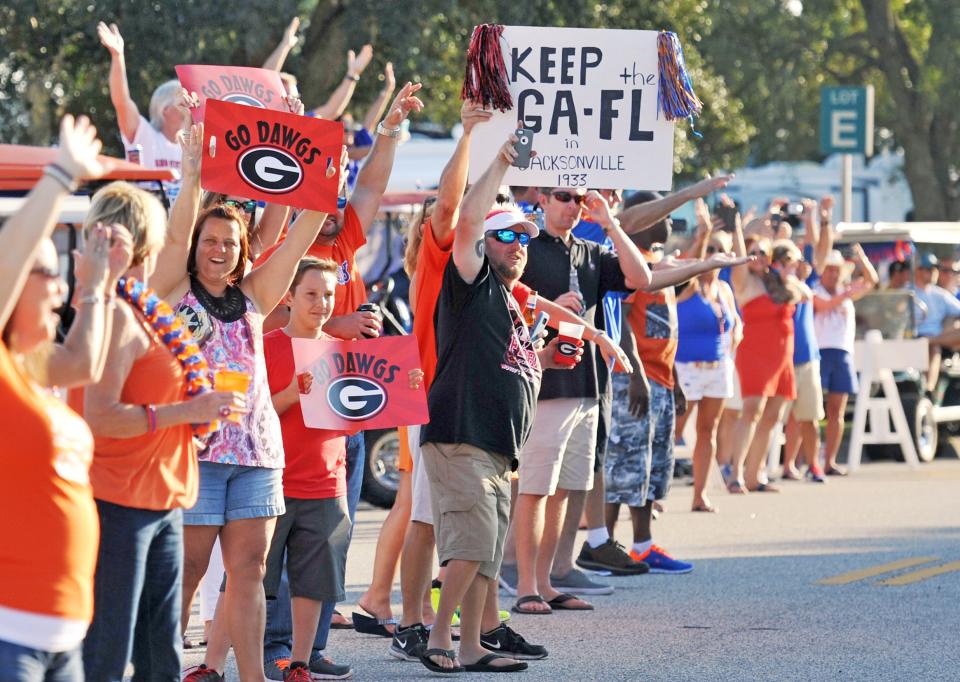 Fans line the road between RV City and EverBank Stadium in 2015 to welcome the Florida and Georgia buses.