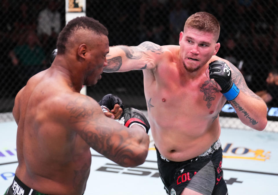 LAS VEGAS, NEVADA – SEPTEMBER 23: (R-L) Jake Collier punches Mohammed Usman of Nigeria in a heavyweight fight during the UFC Fight Night event at UFC APEX on September 23, 2023 in Las Vegas, Nevada. (Photo by Chris Unger/Zuffa LLC via Getty Images)