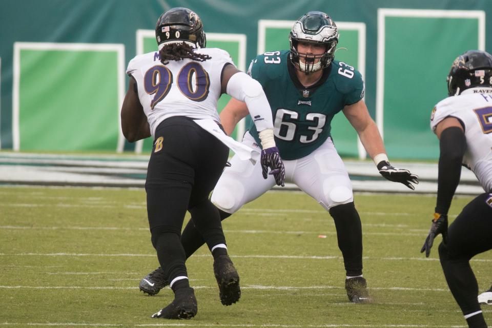 Eagles' Jack Driscoll (63) looks to black Baltimore's Pernell McPhee (90) Sunday, Oct. 18, 2020, at Lincoln Financial Field. 
