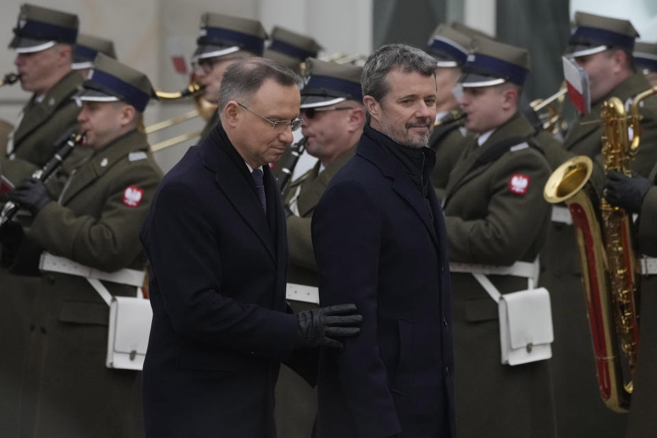 Denmark's King Frederik X, front right, is welcomed by Polish President Andrzej Duda, front left, for a meeting in Warsaw, Poland, Wednesday, Jan. 31, 2024. Frederik began his first trip abroad as monarch on Wednesday with a visit to Poland that is focused on promoting Danish business and climate friendly policies. (AP Photo/Czarek Sokolowski)