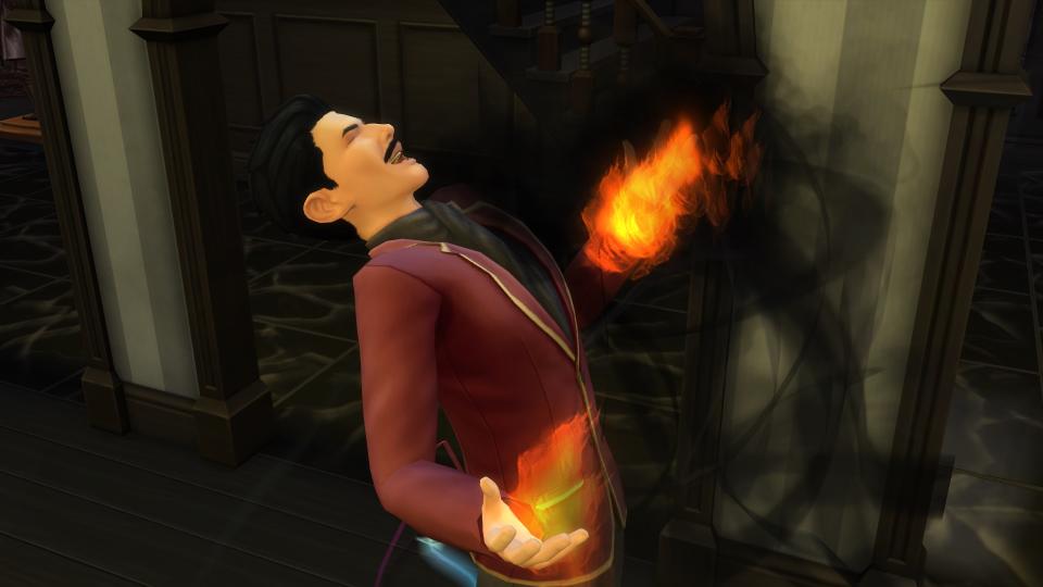 The Sims 4 mod - Become A Sorcerer: Mortimer Goth laughs maniacally with fire in his palms.