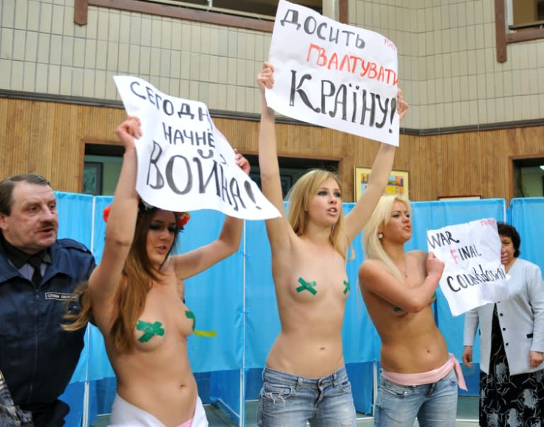 Wearing body-paint slogans and crowns of flowers, Femen activists captured widespread public attention for the first time in February 2010 with a topless protest at a Kiev voting station against Ukrainian president Victor Yanukovych