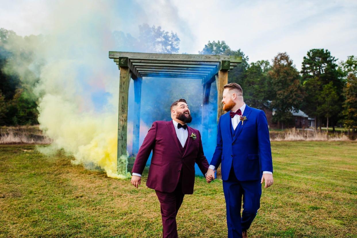 Justin Hipp, left, proposed to Bren Hipp at the 2019 Charlotte Pride parade. A photograph of that moment was briefly featured at the Gaston County Museum of Art and History before the county manager ordered that it be taken down.