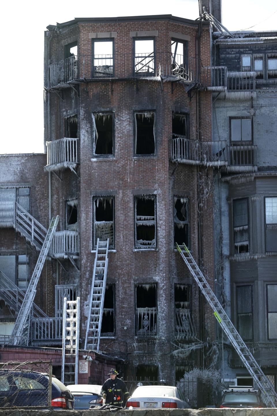 FILE - Ladders lean against the burned remains of a four-story brownstone, March 27, 2014, in Boston. A decade after two firefighters died when they became trapped in the brownstone in Boston’s historic Back Bay neighborhood by a fire caused by sparks from welders working on a building next door, the Massachusetts Senate passed a bill Thursday, March 28, 2024, aimed at toughening oversight of so-called “hot work." (AP Photo/Steven Senne, File)