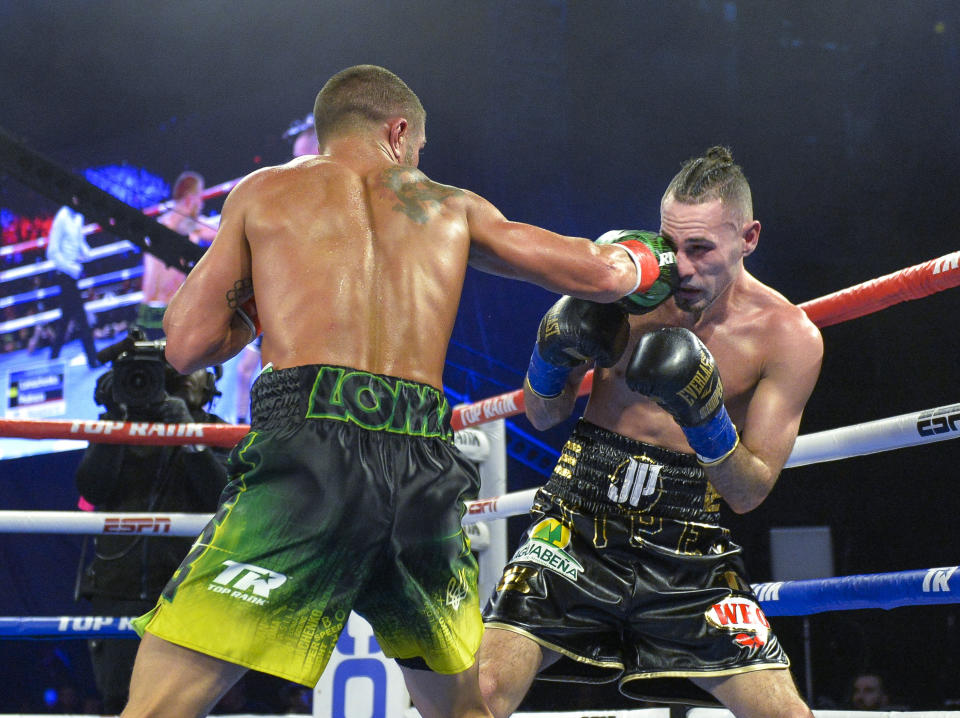 Vasiliy Lomachenko left, lands a punch to the face of Jose Pedraza in lightweight boxing match at Madison Square Garden, Saturday, Dec. 8, 2018, in New York. (AP Photo/Howard Simmons)