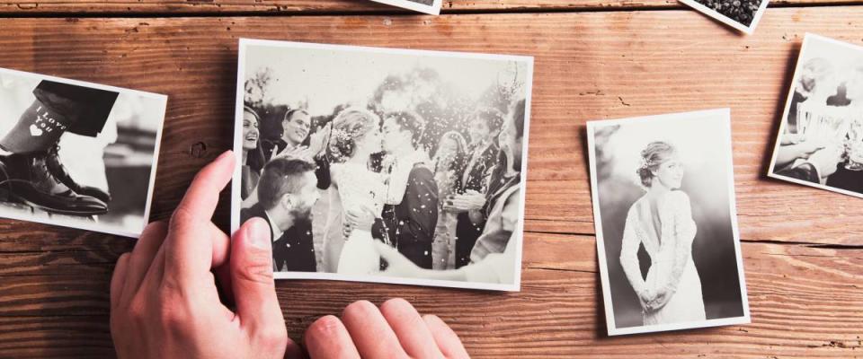 Wedding photos laid on a table