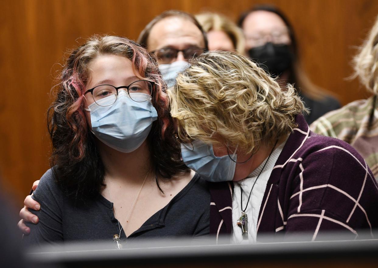 Sandra Cunningham of Oxford comforts her daughter Phoebe Arthur,15, who was a shooting victim of Ethan Crumbley, during his pretrial hearing at Oakland County Courthouse, Monday, Oct. 24, 2022, in Pontiac, Mich. 