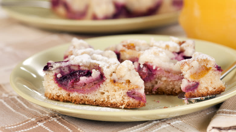 Sliced plum torte on a plate