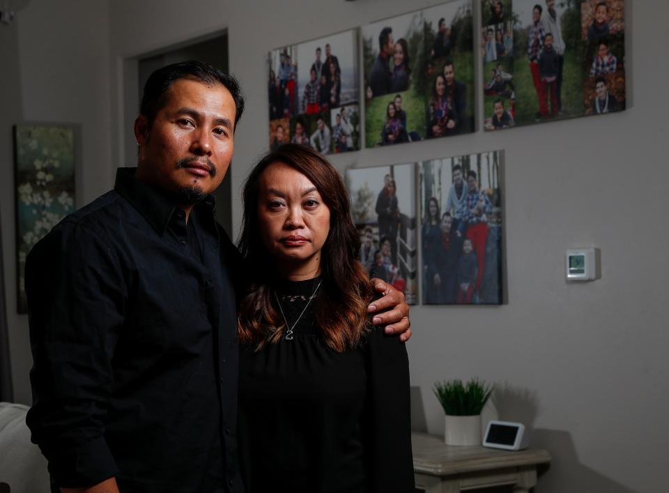 Twan and Manee Vongphakdy pose for a portrait on Wednesday, May 3, 2023, at their home in Weston, Wis. Their son, who recently graduated from Wausau East High School, was the target of a series of racist, sexist and homophobic remarks by band director Robert Perkins.