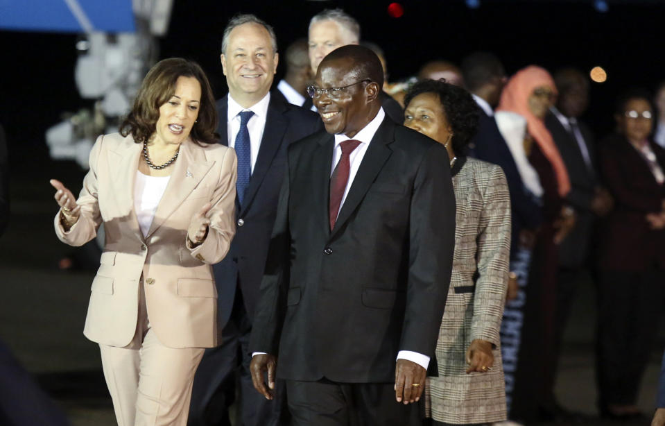 Vice President Kamala Harris talks with Tanzania's Vice President Philip Mpango as she arrives at the Julius Nyerere Airport in Dar es Salaam, Tanzania, Wednesday, March 29, 2023, the second stop of a three-nation tour of Africa. (Emmanuel Herman/Pool Photo via AP)