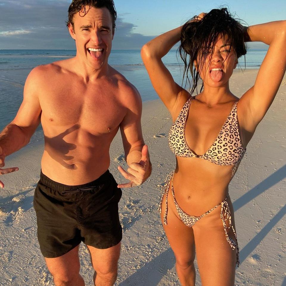 Nicole Scherzinger and her boyfriend, Thom Evans, pose on the beach