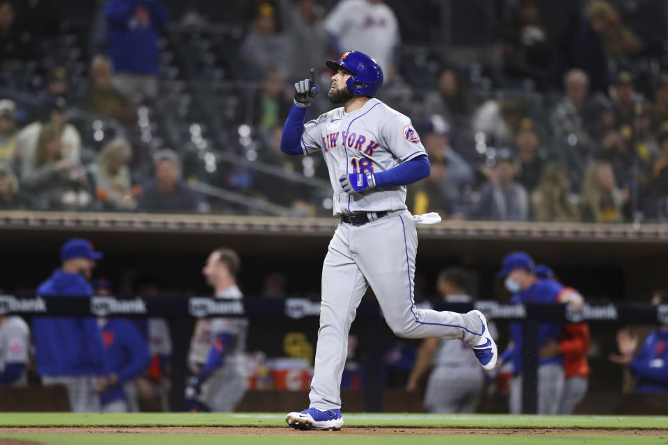 New York Mets' Jose Peraza points to sky after hitting a solo home run in the fifth inning of the team's baseball game against the San Diego Padres on Saturday, June 5, 2021, in San Diego. (AP Photo/Derrick Tuskan)