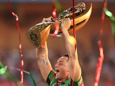 John Sutton lifts the NRL premiership trophy