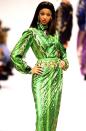 <p>She continued to dominate the runway, rocking a green sequined animal-print gown during Paris Fashion Week in 1993.</p>