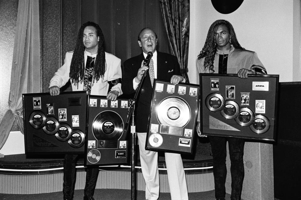 Arista Records CEO Clive Davis with Milli Vanilli in 1989. (Lester Cohen/Getty Images)