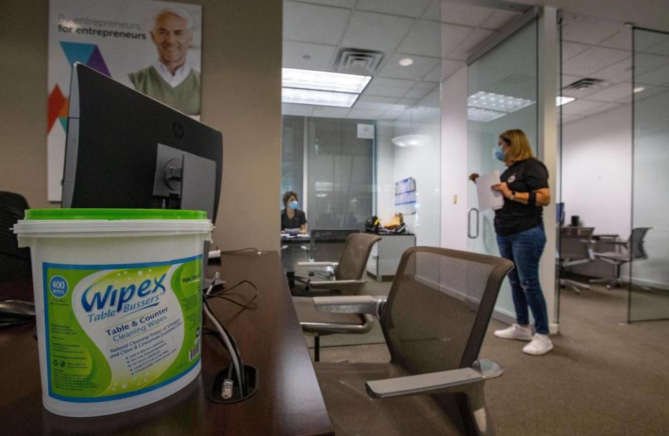 Disinfecting wipes are at the ready at Apollo Bank on Friday, May 22, 2020. Miami-Dade County has reopened for business after shutting down for two months due to the coronavirus pandemic. When office workers return, masks, staggered seating and revolving shifts to maintain distancing will be commonplace including at banks.