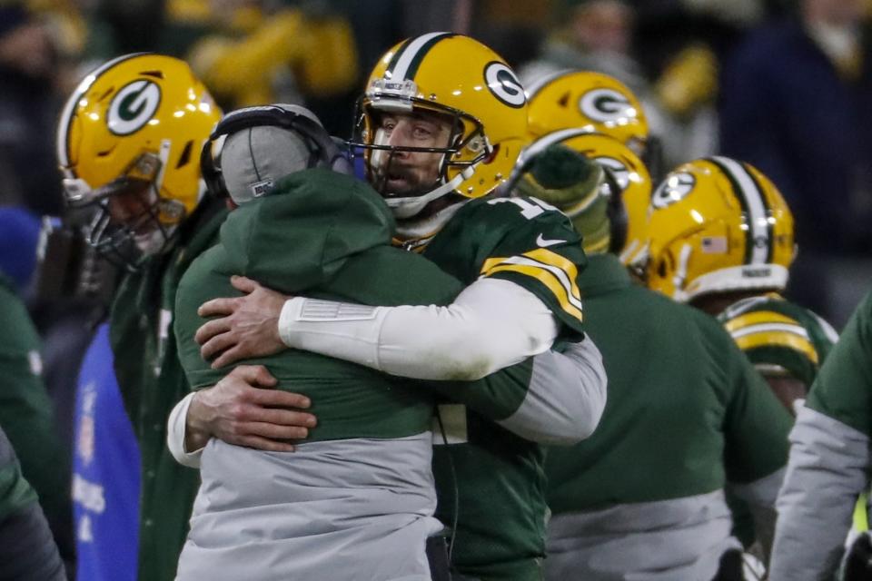 Green Bay Packers head coach Matt LaFleur celebrates a touchdown with Aaron Rodgers during the second half of an NFL divisional playoff football game against the Seattle Seahawks Sunday, Jan. 12, 2020, in Green Bay, Wis. (AP Photo/Matt Ludtke)