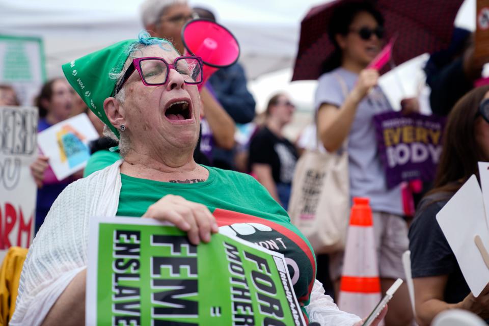 Abortion rights demonstrators hold signs as they gather for the Women's March in Washington, Saturday, June 24, 2023. Abortion rights and anti-abortion activists held rallies Saturday in Washington and across the country to call attention to the Dobbs v. Jackson Women’s Health Organization ruling on June 24, 2022, which upended the 1973 Roe v. Wade decision.