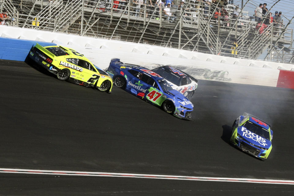 NASCAR Cup Series drivers Ricky Stenhouse Jr. (47), Austin Cindric (2), Kevin Harvick (4) and Erik Jones (43) crash during the NASCAR Cup Series auto race at Atlanta Motor Speedway in Hampton, Ga., Sunday, March 20, 2022, (AP Photo/Skip Willimas)