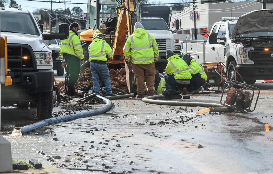 Electric City Utilities workers fix a water line break near the Anderson Mall on North Main in Anderson, S.C. Friday, January 7. 2022. 