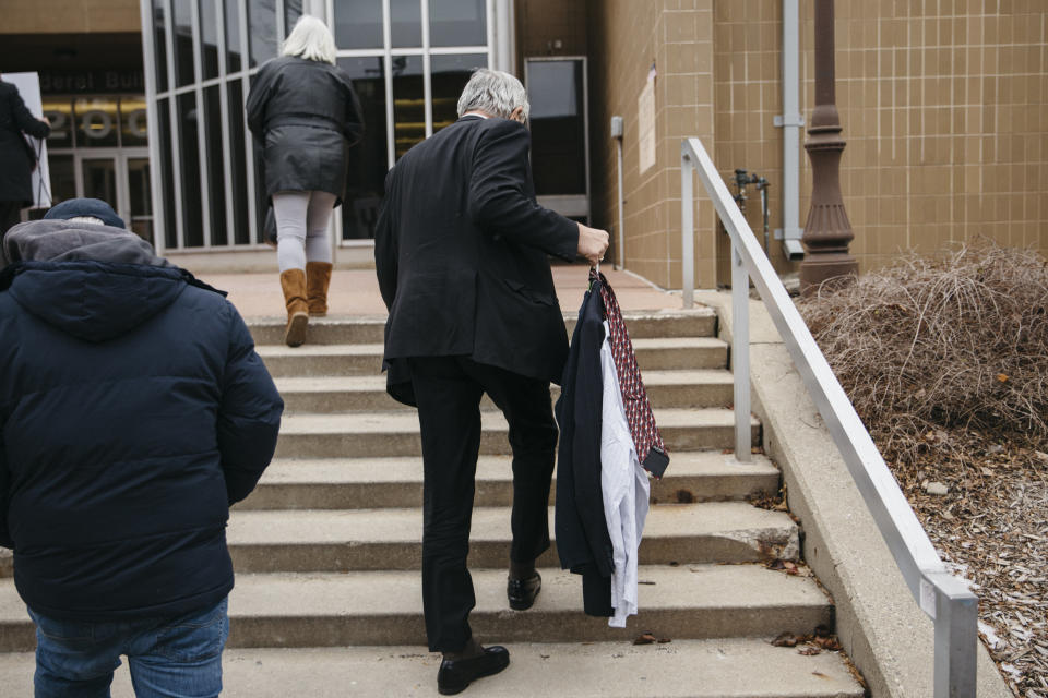 Gary Benjamin holds extra clothes meant for detained asylum-seeker Ansley Damus on Wednesday, Nov 28, 2018. Benjamin and his wife, Melody Hart, helped organize a group of about 30 people to travel from Cleveland Heights, Ohio, to Ann Arbor, Michigan, to show their support for Damus.&nbsp;