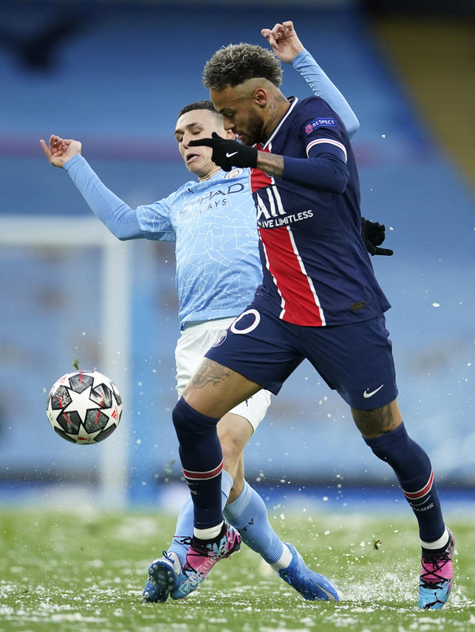 Manchester City's Phil Foden, left, challenges PSG's Neymar during the Champions League semifinal second leg soccer match between Manchester City and Paris Saint Germain at the Etihad stadium, in Manchester, Tuesday, May 4, 2021. (AP Photo/Dave Thompson)