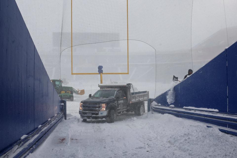 Gov. Kathy Hochul's official social media account posted that she had been in contact with NFL commissioner Roger Goodell "regarding the dangerous conditions in Buffalo. Workers removed snow from Highmark Stadium on Sunday.