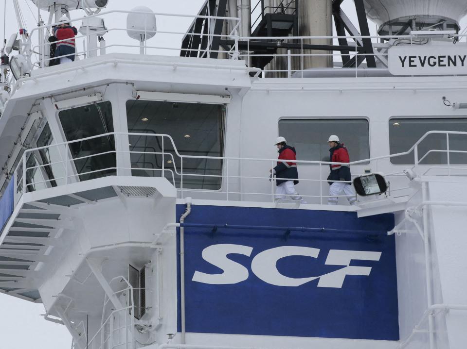 The logo of Russian state shipping company Sovcomflot is seen on the multifunctional icebreaking standby vessel "Yevgeny Primakov" moored in central St. Petersburg