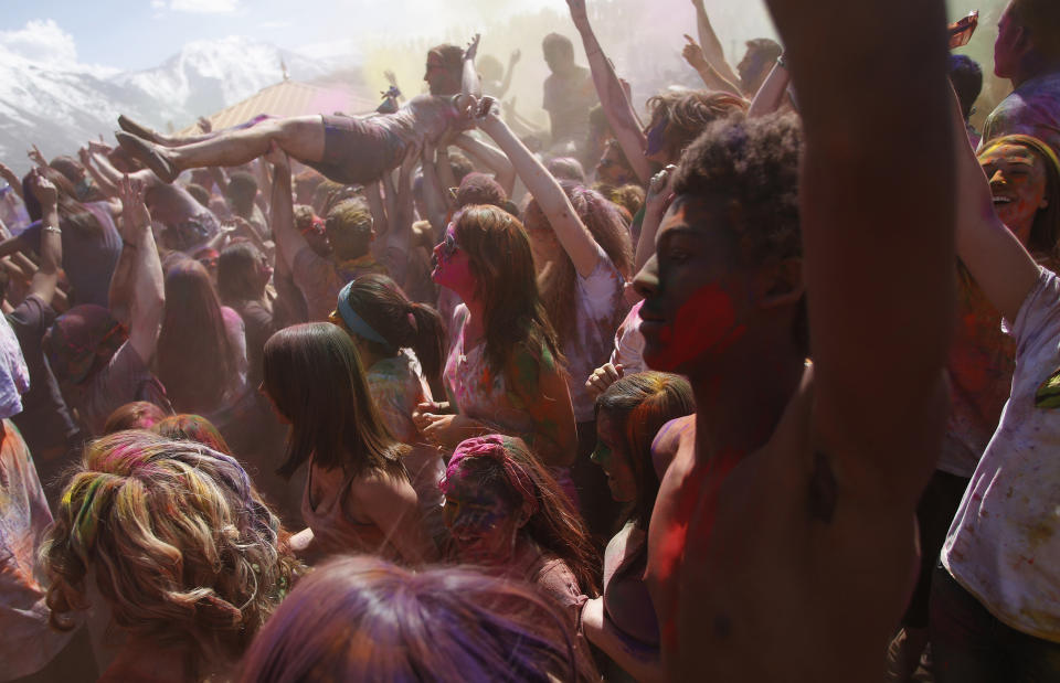 &nbsp;Participants crowd surf, dance and throw colored chalk during the Holi Festival of Colors at the Sri Sri Radha Krishna Temple in Spanish Fork, Utah, March 30, 2013.