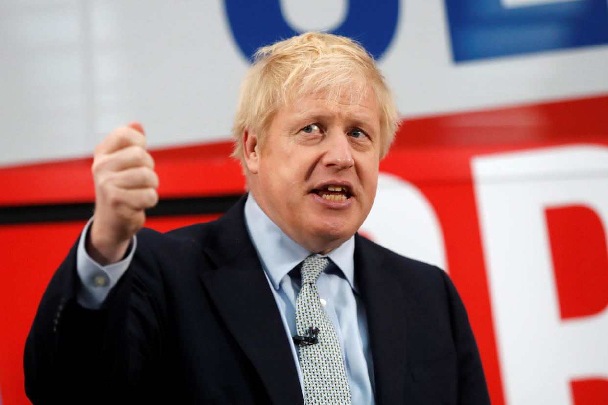 Britain's Prime Minister Boris Johnson addresses his supporters in front of the general election campaign trail bus in Manchester, Britain November 15, 2019. Frank Augstein/Pool via REUTERS