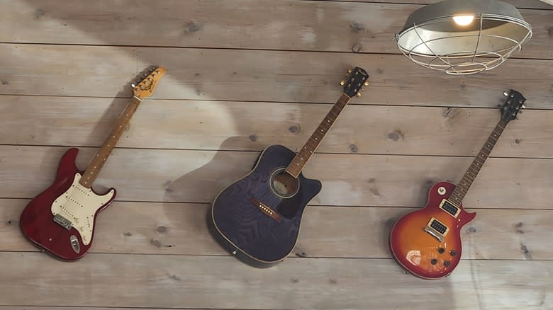 guitars on wall in Fayetteville Slim Chickens